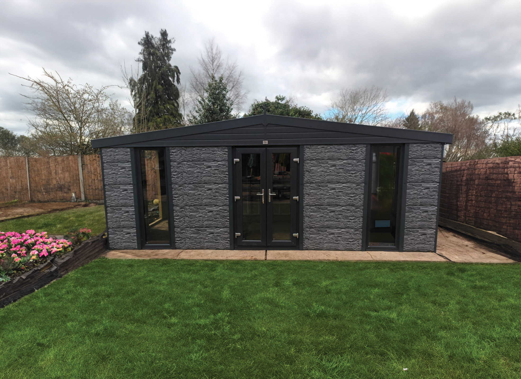 Insulated steel garden room